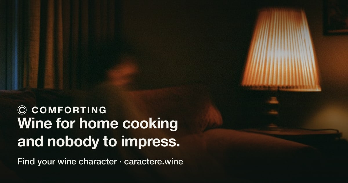 Ⓒ Comforting — Wine for home cooking and nobody to impress. Over an empty sofa under a warm lamp, a blanket over the arm.