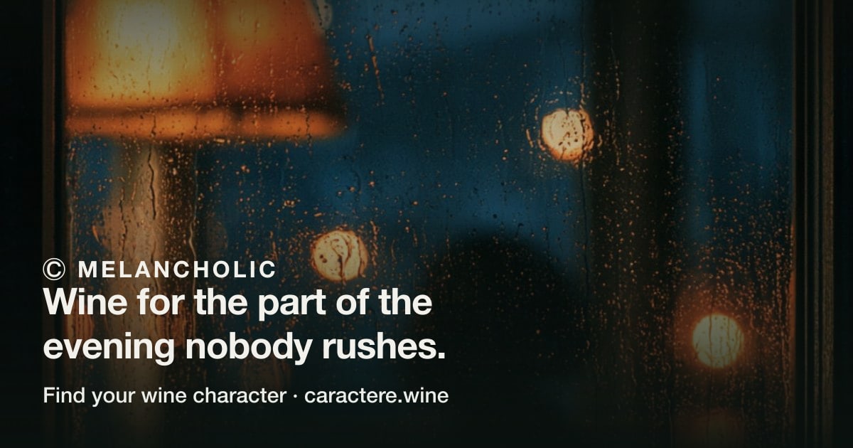 Ⓒ Melancholic — Wine for the part of the evening nobody rushes. Over rain running down a window, warm street lights blurred behind it.