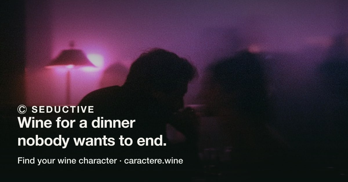 Ⓒ Seductive — Wine for a dinner nobody wants to end. Over two people leaning towards each other in a dim room, a pink lamp behind them.
